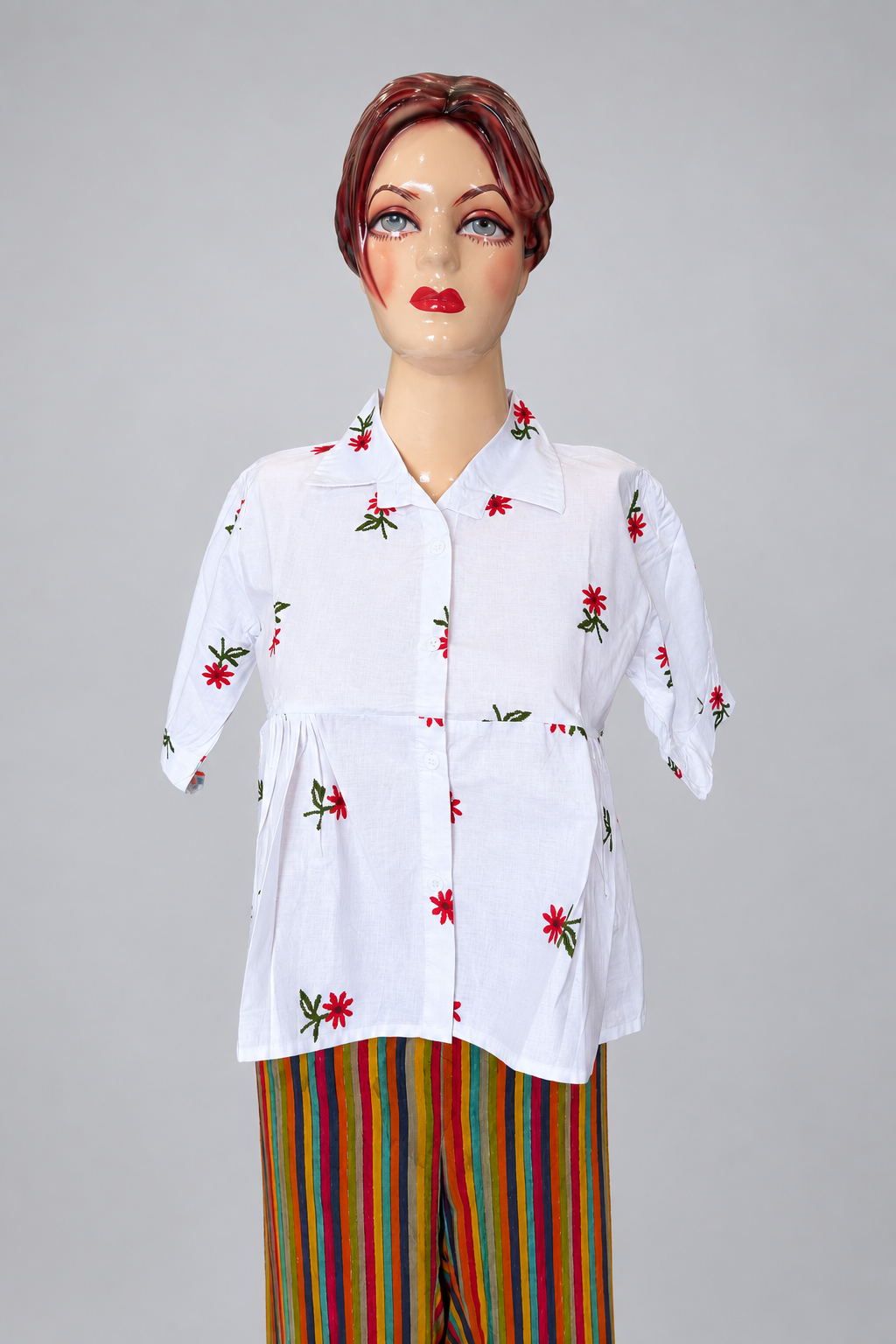 Peplum top on a light-grey studio background